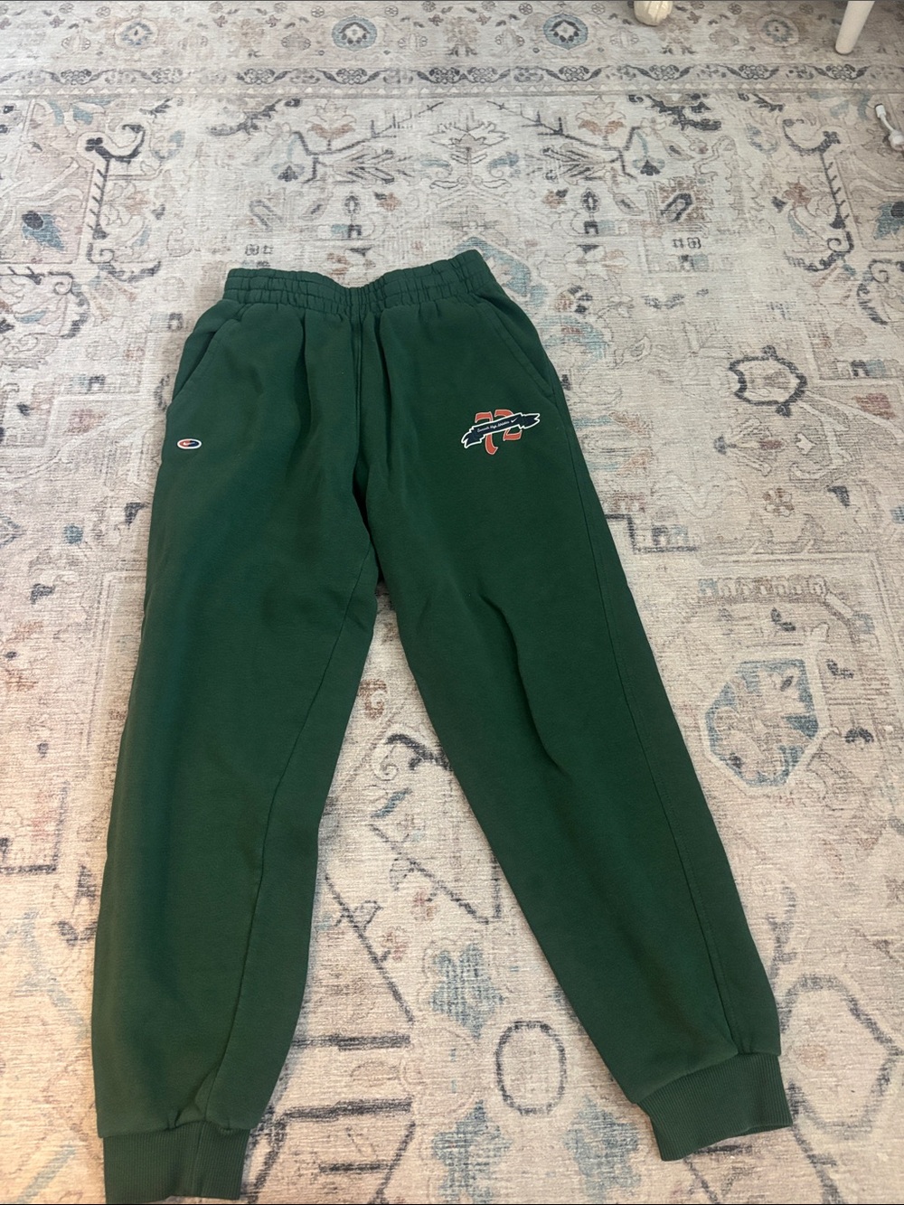 Nike Dark Green Kids Sweatpants with Orange Logo Accent